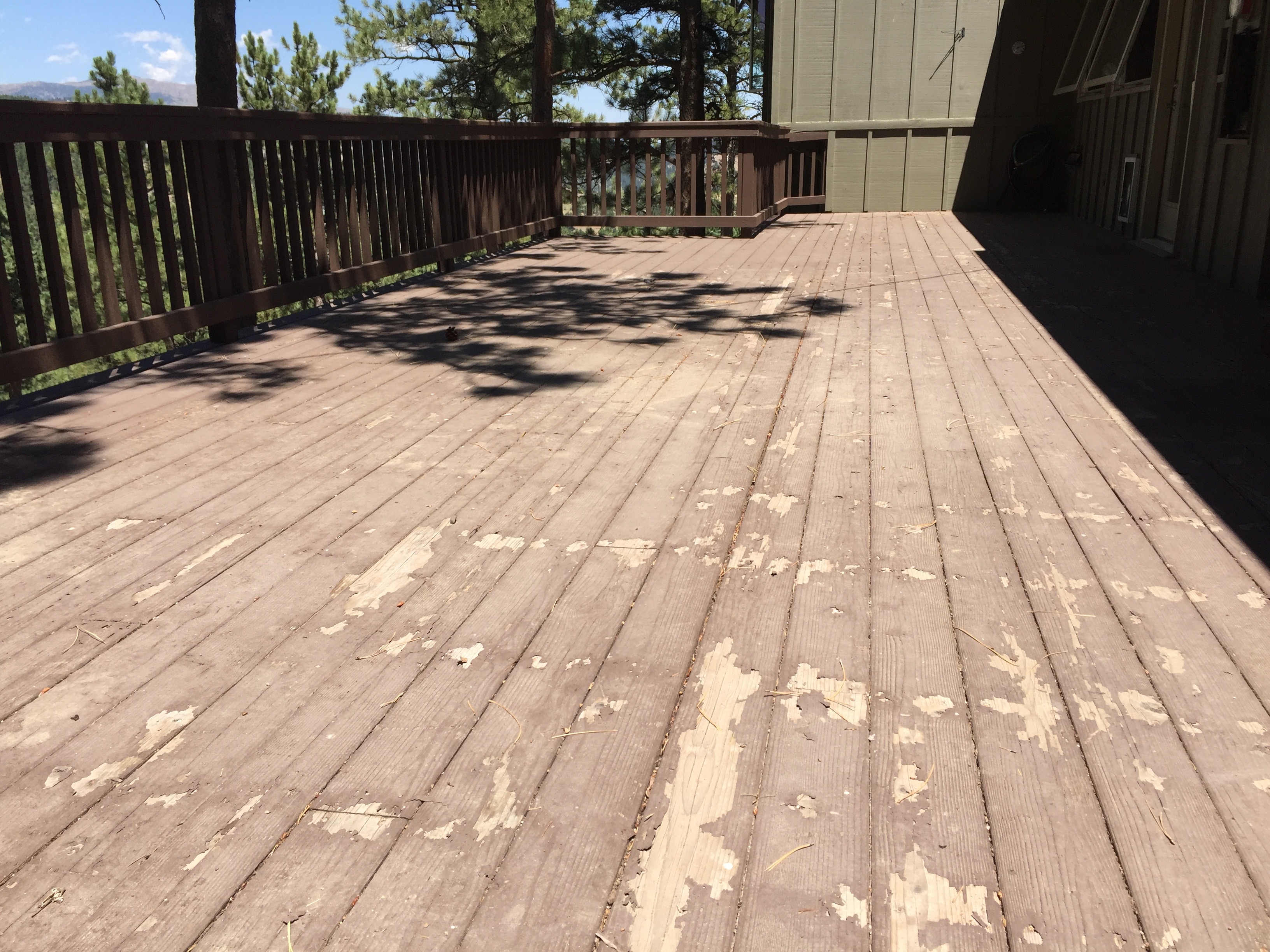 peeling deck paint in need of refinishing